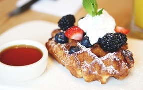 Sweet waffle with cream and berries