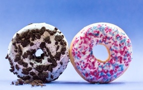 Two sweet donuts on a blue background