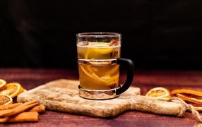 A glass of hot orange mulled wine