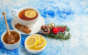 Cup of tea on the table with lemon and honey