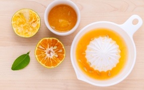 Fresh orange juice on a wooden table