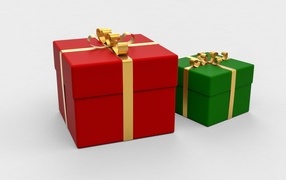 Красная и зеленая подарочная коробка на белом фоне