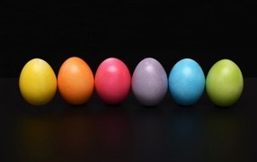 Multicolored Easter eggs on a black background