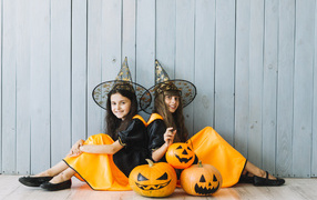 Two little girls in Halloween costumes