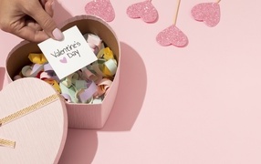 Heart-shaped box with wishes for Valentine's Day
