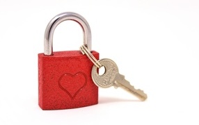 Red padlock with heart on white background
