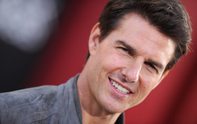Actor Tom Cruise on a red background