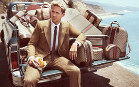 Canadian actor Ryan Gosling in the trunk with suitcases