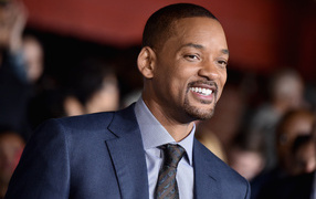 Smiling actor Will Smith in suit