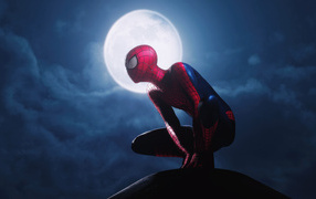 Spiderman sits against the background of the moon