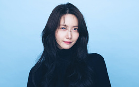 Korean singer Yoona on blue background