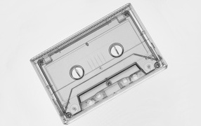 Transparent cassette on gray background