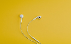 White headphones on a yellow background