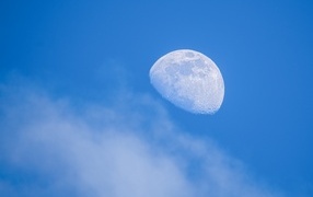 Big white moon in the blue sky
