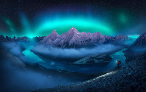 Beautiful view from above of the northern lights over the mountains