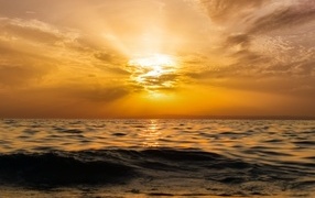 Beautiful sunset of the bright sun over the sea