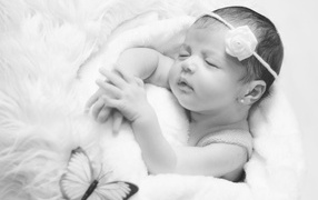 Beautiful black and white photo of a newborn girl