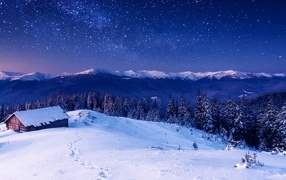 Beautiful starry night over snow-capped mountains