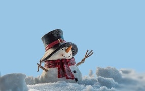 Snowman on a blue background in winter