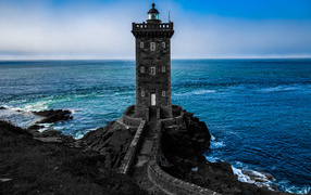Large stone lighthouse on the coast of France