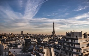 Rooftop view of the city of Paris under a beautiful sky