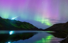 Beautiful aurora in the sky over the mountains of Iceland