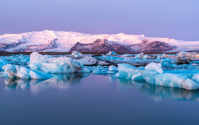 Blue icebergs in the water off the coast of Iceland