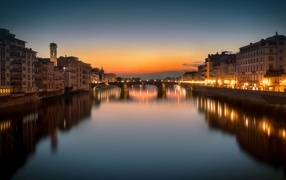 Beautiful view of houses and river in the evening, Italy