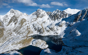 High snow-capped mountains with a small lake, Spain