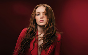 American actress Sadie Sink on a red background