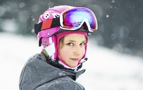 Girl snowboarder in a helmet