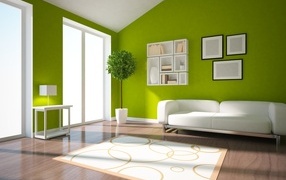 Green walls in the living room with a white sofa