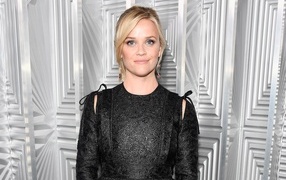 Young actress Reese Witherspoon in a black dress