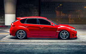 Red car Subaru Impreza WRX STI side view