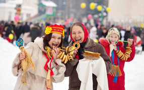 Women with treats for Maslenitsa holiday