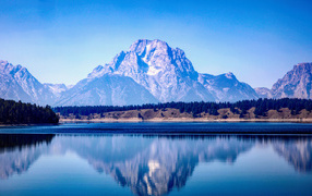 View of a mountain peak near a lake