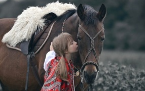 Girl with a big brown horse