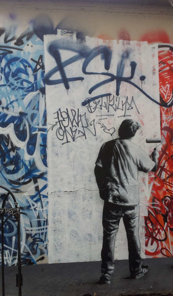 Уличный художник нарисован на стене
