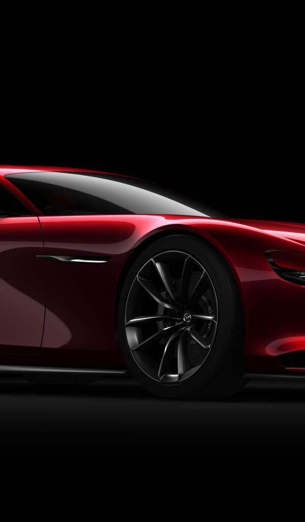 Красный спортивный автомобиль Mazda RX Vision Concept на черном фоне