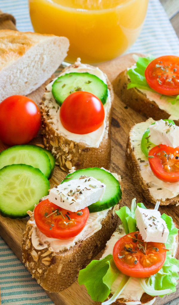 Sandwiches with cheese cucumbers and tomatoes for breakfast