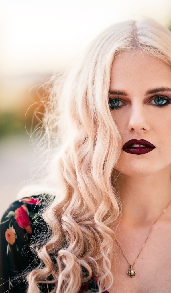 Beautiful blonde girl with red lips