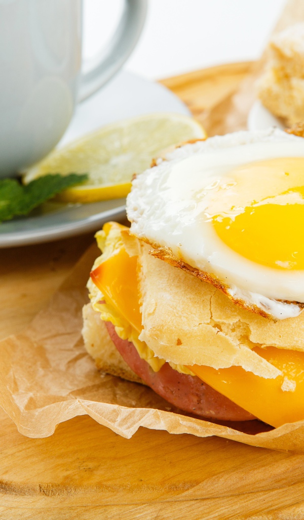 Sandwich with scrambled eggs for breakfast