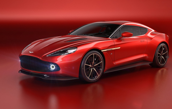 Стильный красный автомобиль Aston Martin Vanquish Zagato на красном фоне 
