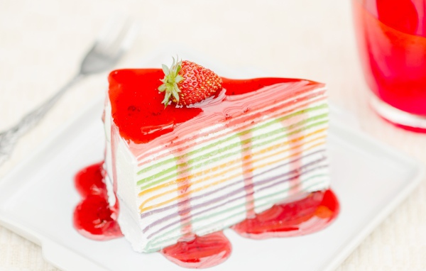 Cake with colorful cakes and strawberry jam