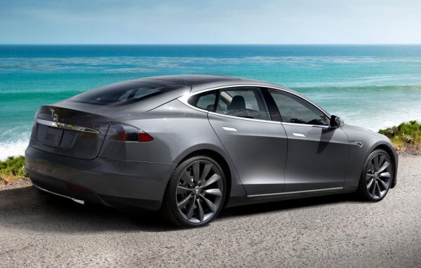 Tesla Model S electric car on background of ocean