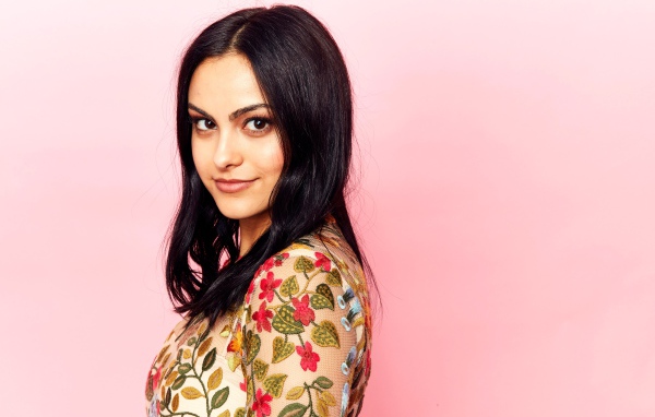 Young actress Camila Mendes photo on a pink background