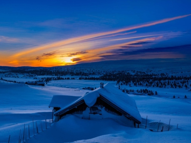 Snow-covered hut