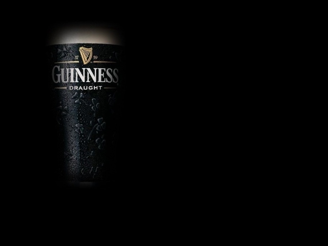 Dark beer Guinness on a dark background