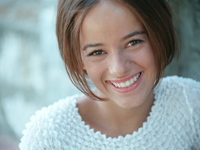 French singer Alizee in white sweater