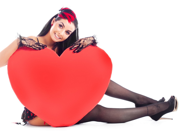 Beautiful girl with big red heart